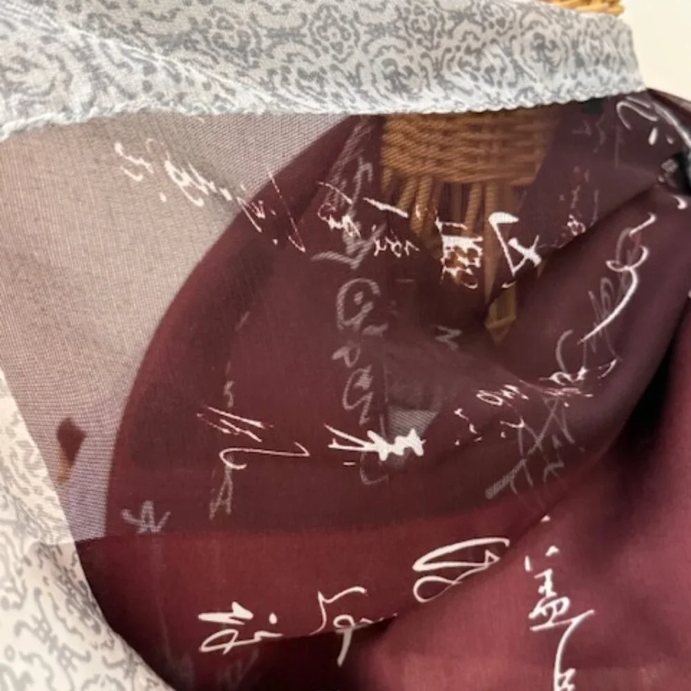 100% silk wine colored and silver oblong scarf.
